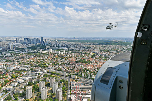 Au loin, de gauche à droite, La Défense, La Tour Eiffel et la Tour Montparnasse