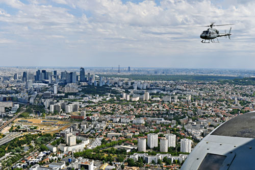 Au loin, de gauche à droite, La Défense, La Tour Eiffel et la Tour Montparnasse